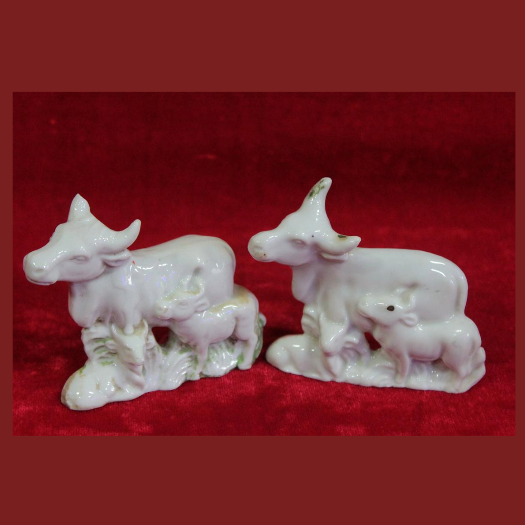 Untitled-2025-09-24T150624.928.png Antique Porcelain Cow Toys (Set of 2) – Vintage Farm Decor Figurines - Image 1